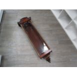 A rosewood Vienna wall clock case and pendulum (no face or movement), 122cm tall