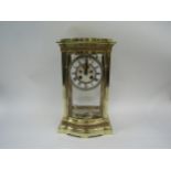 A Mid to late 19th Century French (AD Mougin) brass four glass mantel clock with bowed glass front