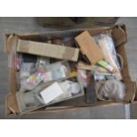 Two boxes of raw materials and consumables and spares including marksprings, glasses, fusee and