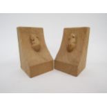 A pair of Robert Thompson 'Mouseman' of Kilburn English oak bookends, each carved with mouse