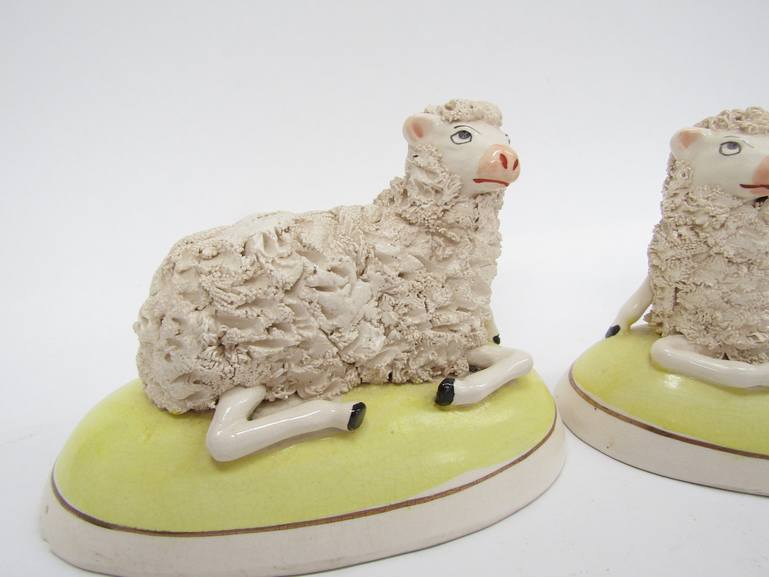 A pair of Staffordshire sheep in yellow domed bases (slight damage), 9cm x 14cm - Image 2 of 4