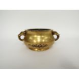 A Chinese gilt bronze censor with elephant form handles, some wear, sixteen character marks to base,