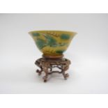 A Chinese Kangxi (1662-1722) yellow glaze bowl decorated with dragon and phoenix with blue double