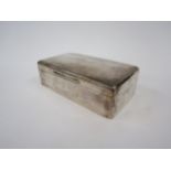 A William Comyns & Sons silver cigarette box, rounded rectangular form, plain design, lined interior