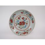 An 18th Century Famille Rose porcelain shallow bowl, red border and floral sprays enriched with