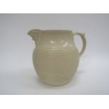 A 19th Century Minton Drabware ribbed jug with Bacchus mask spout, 19cm tall, 23cm wide