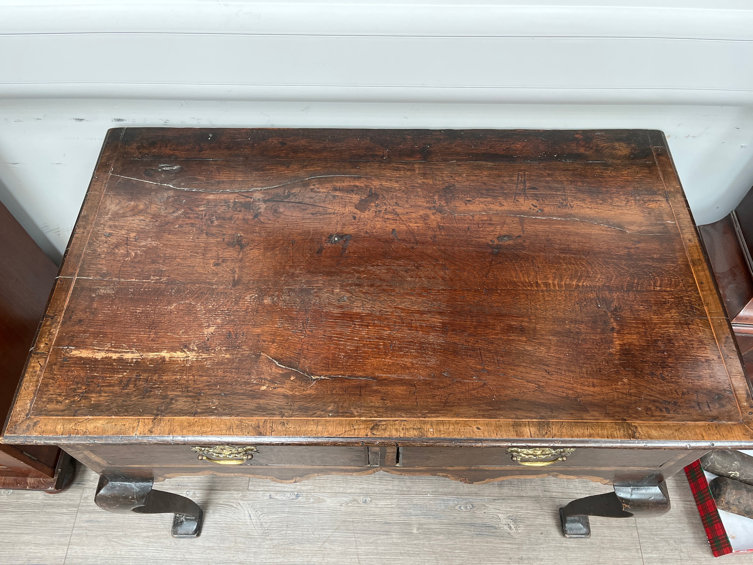 A Georgian oak lowboy with two drawers on cabriole legs to pad feet, 75cm x 96cm x 55cm - Image 2 of 3