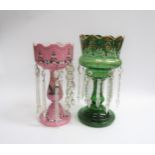 Two Victorian table lustres, pink opaque glass and green clear glass, with crystal droplets