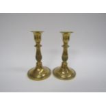 A pair of 19th Century brass candlesticks with ring turned detail