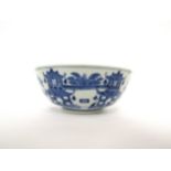A Chinese blue and white porcelain slop bowl, the exterior with pagoda and coastal scenes, chip