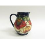 A Moorcroft Anna Lily pattern jug by Nicola Slaney, 14.5cm tall