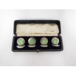 A set of four Sampson Mordan & Co Ltd silver menu/place name holders with green enamel guilloche