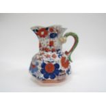 A 19th century large Imari stoneware jug with mythical serpent handle, 24cm tall