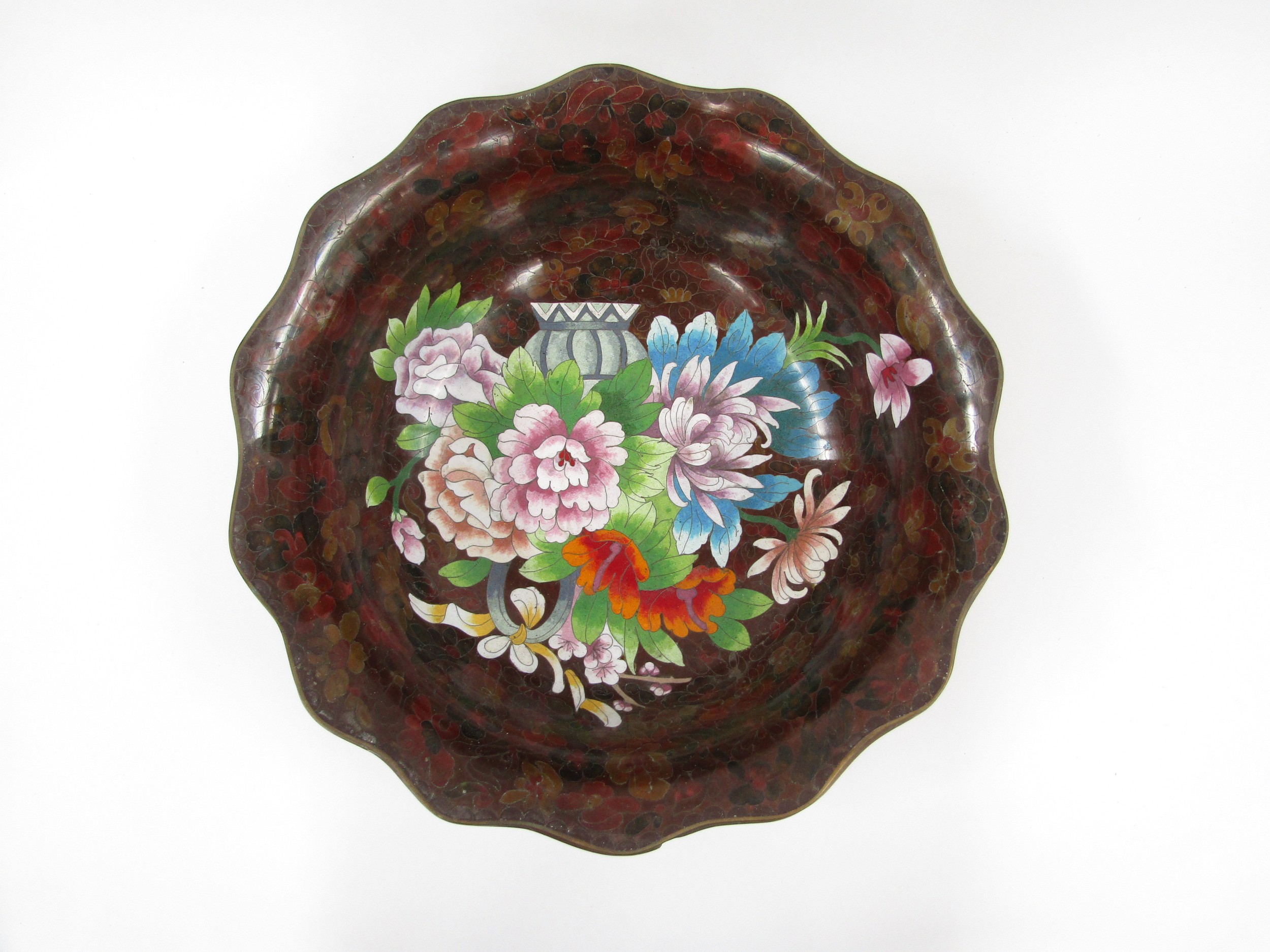 A large Republic Period Chinese cloisonné enamel bowl with Famille rose decoration on a rich rouge