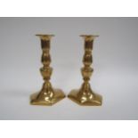 A pair of 19th Century brass ejector candlesticks