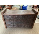 An Eastern carved wood chest, foliate front panel, lift plank lid, 87cm x 132cm x 48cm