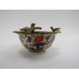 A 19th Century Chinese Imari tea bowl with deer pattern, later ormolu decorative bird mount, marks