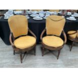 A set of six Waring dining chairs oval caned seats, on reeded supports with cross stretcher base