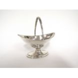 A Hester Bateman silver boat shaped pedestal bonbon dish with overhead swing handle, London 1789,