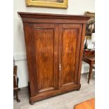 A Victorian mahogany wardrobe, twin doors opening to reveal hanging and drawer space