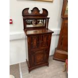 A Victorian rosewood mirror-back music cabinet, marquetry panels of musical instruments, twin door