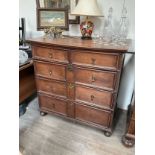 A 19th Century oak two over three chest of drawers with drop handles (one missing) on squashed bun