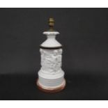 A white porcelain table lamp base with classical putti relief, 37cm tall, chip to base