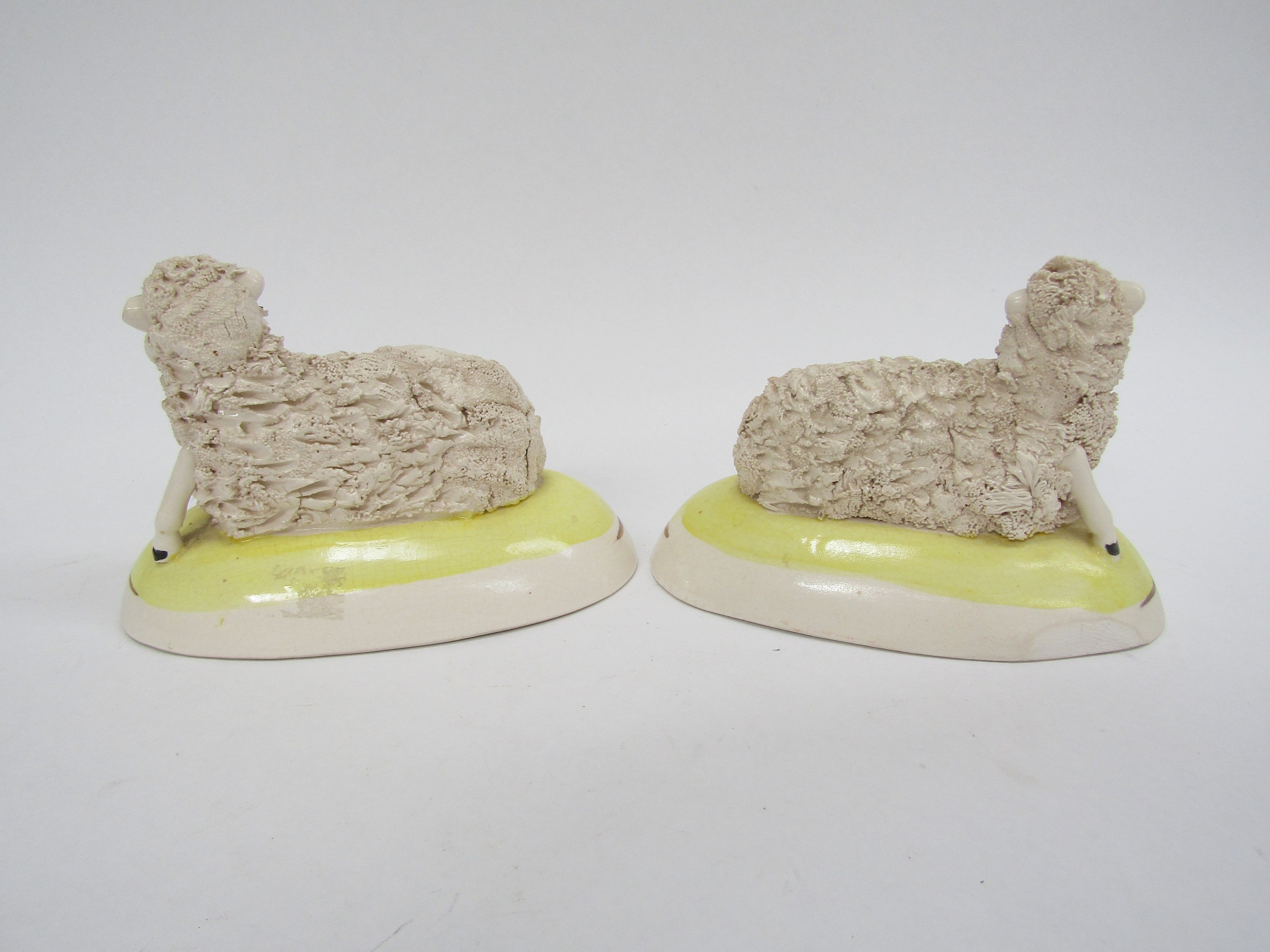 A pair of Staffordshire sheep in yellow domed bases (slight damage), 9cm x 14cm - Image 4 of 4