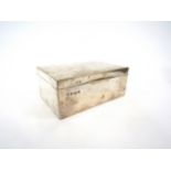A silver cigarette box of rectangular plain form, some indentations, 14cm x 9cm x 6cm, Birmingham