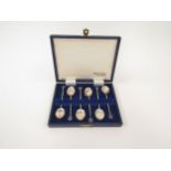 A set of six sterling silver coffee spoons with opal set terminals, within Fairfax and Robert’s of