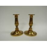 A pair of 19th Century brass candlesticks and a pair of glass salts