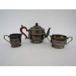 An Alexander Clark & Co Ltd., silver three piece teaset of Deco form with Bakelite handle and