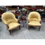 A near pair of mahogany scroll armchairs, serpentine shaped front on carved cabriole legs, deep