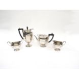 A Roberts and Belk four piece silver tea set comprising of teapot, water jug, sugar bowl and milk