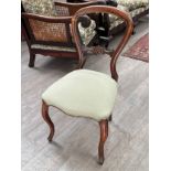Six 19th Century walnut balloon back chairs with overstuffed seats, cabriole legs