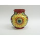 A Moorcroft Inca Sunflower pattern squat form vase, 15cm tall