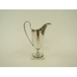 An F.B & Co. silver cream jug on square base, Sheffield 1935, 13cm tall, 87g