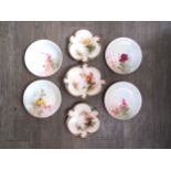 A set of four Royal Worcester plates depicting roses, together with three Harley’s Worcester cabinet