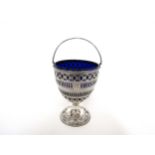 A Hester Bateman silver pierced sugar basket of goblet form, overhead swing handle, Bristol blue