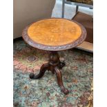 A Victorian walnut tripod wine table. marquetry inlaid design of horse and rider and foliage on burr