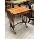 A Regency rosewood sofa table with single drawer, lyre ends and stretcher base, 74cm x 61cm flaps