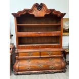 An 18th Century Dutch walnut Baroque cabinet, the top section set with shelving and concealed