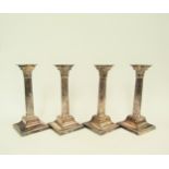 A set of four Mappin & Webb Princes Plate Corinthian form candlesticks, 26cm tall