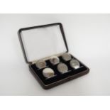 A Sampson Mordan silver set of six Art Deco table markers, circular form, Chester 1905, cased, 250g