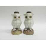 Two ceramic oil lamp bases in the form of Owls, white glazed and with blue Anchor mark and impressed