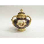 A Coalport topographical three handle potpourri vase and cover, painted in cobalt blue and gilt,