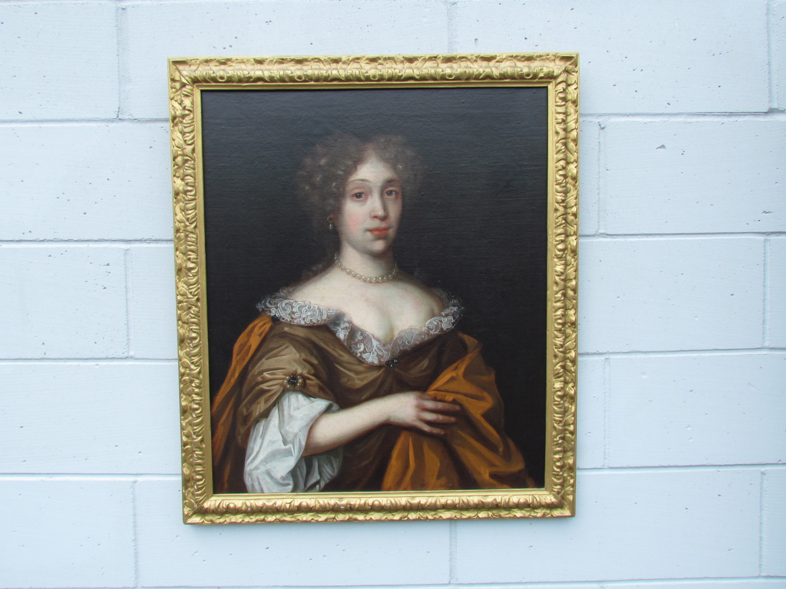 Follower of Willem Wissing a 17th Century portrait of a lady possibly Mary of Modena, with curly