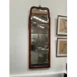 An early mid 18th Century walnut wall mirror, bevelled original glass in two sections