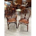 A set of six hoop back Windsor chairs with pierced central splat and stick back rest over a saddle