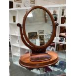 A Victorian mahogany framed oval swing toilet mirror, 68cm tall